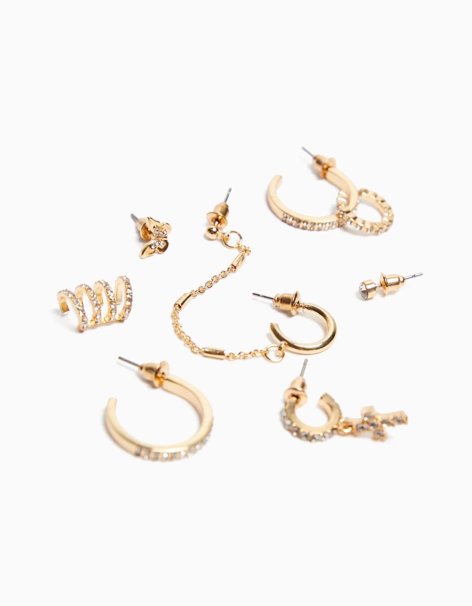 BERSHKA Set 8 pendientes aros ear cuff pedrería cruz Oro Outlet
